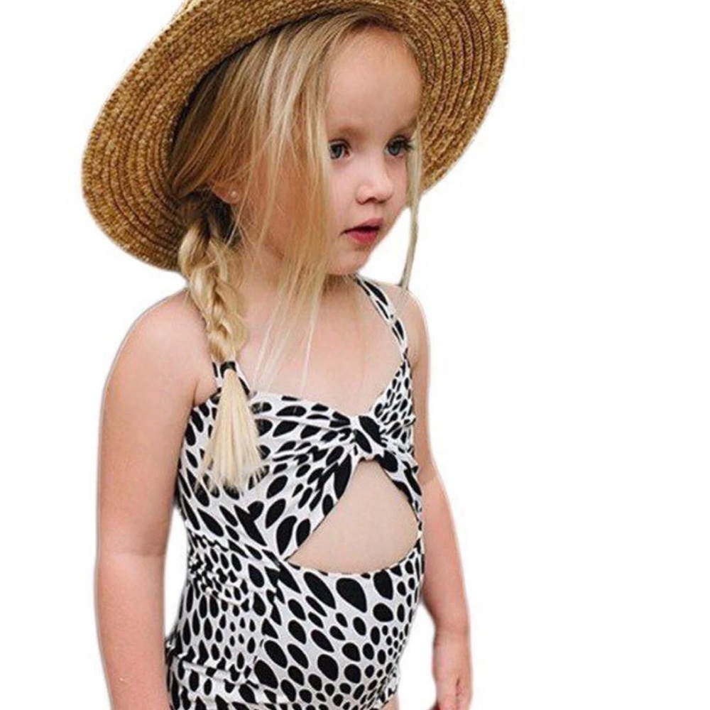 White and black animal print peek a boo suit